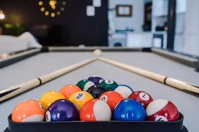 a bowl of billiard balls on a pool table at Pool Table, Stunning 2Bed Apt, Central Location in Liverpool