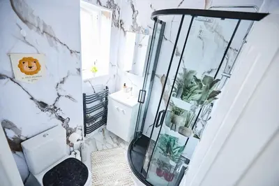 a glass shower in a bathroom with a toilet at Ampee Guest Suite-Free Parking in Liverpool