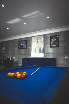 a billiard room with a pool table with balls at Finsters Retreat in Ainsdale