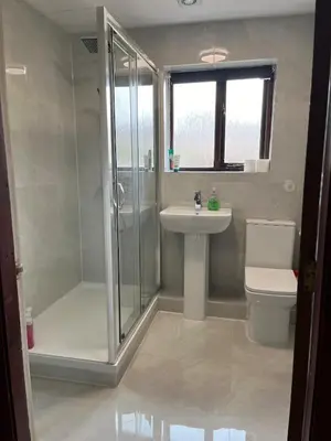 a bathroom with a shower and a sink and a toilet at Preston 4 bedroom house near M55 & M6 in Woodplumpton