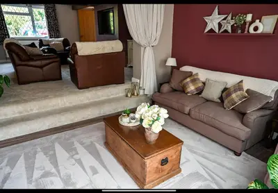 a living room with a couch and a coffee table at Beautiful apartment at field view cottage in Eccleston