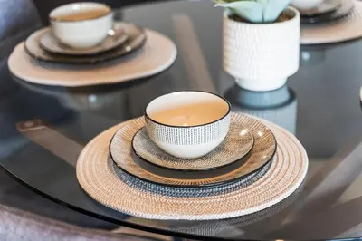 a glass table with three cups of coffee on plates at Liverpool City Stay 2BR Apartment Sleeps 3 in Liverpool