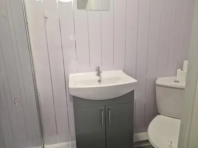 a bathroom with a sink and a toilet at Desto lodge in liverpool in Liverpool