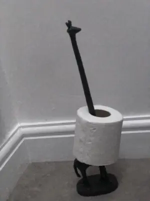 a toilet paper holder with a stick in it at Fitzys Terrace Three Bed in Accrington