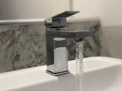 a sink with water coming out of a faucet at Fitzys Terrace Three Bed in Accrington