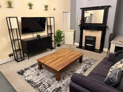 a living room with a couch and a coffee table at Oswaldtwistle Spacious 3 Bedroom Two Bath in Oswaldtwistle