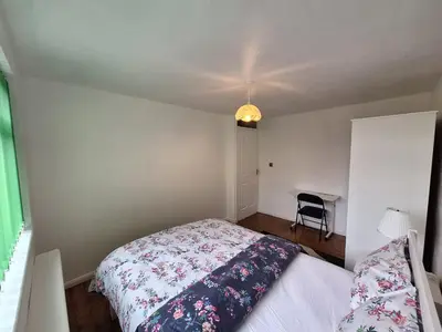 a small bedroom with a bed and a desk at Liverpool Rooms Near City & Stadiums in Liverpool