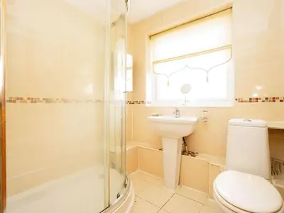 a bathroom with a toilet and a sink and a shower at Liverpool Rooms Near City & Stadiums in Liverpool