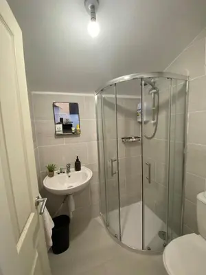 a bathroom with a shower and a sink at Wadham Suites in Liverpool