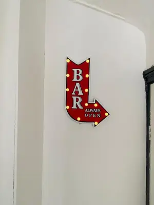 a sign for the bahra always offer on a wall at Wadham Suites in Liverpool
