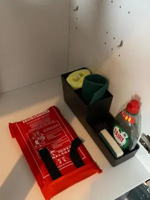 a book sitting on a counter next to a box of detergent at Wadham Suites in Liverpool