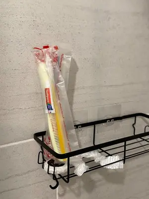 a shelf in a room with toothbrushes at Wadham Suites in Liverpool