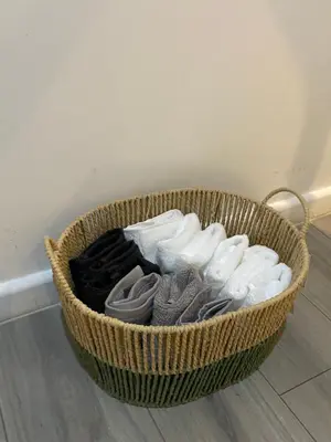 a basket full of clothes sitting on the floor at Wadham Suites in Liverpool
