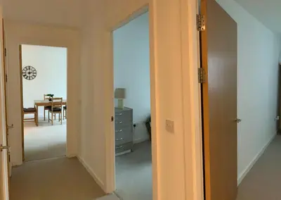 an open door to a dining room with a table at Spacious City Centre 2 Bedroom Apartment in Liverpool