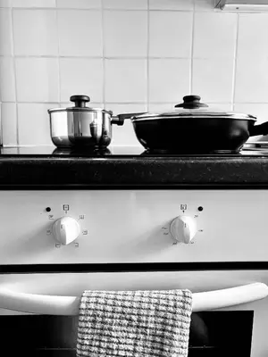 a stove top with two pots on top of it at Garrick's Suite-Home away from Home- suitable for couples retreat, Contractors and NHS- free parking in Southport