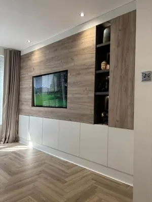 a living room with a tv on a wall at Seaside Retreat Luxury Apartment in Liverpool
