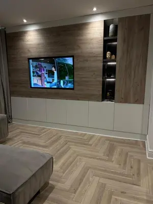a living room with a flat screen tv on a wall at Seaside Retreat Luxury Apartment in Liverpool