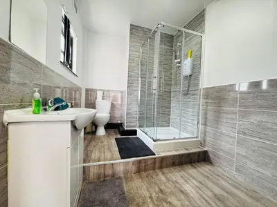 a bathroom with a shower and a sink and a toilet at Pembroke Place Private Room 9 in Liverpool