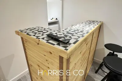 a black and white checkered counter with two remote controls at Crews Cabin in Fleetwood