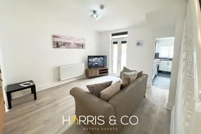 a living room with a couch and a tv at Bosun's Bay in Fleetwood