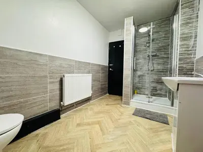 a bathroom with a shower and a toilet and a sink at Pembroke Place Private Room 1 in Liverpool