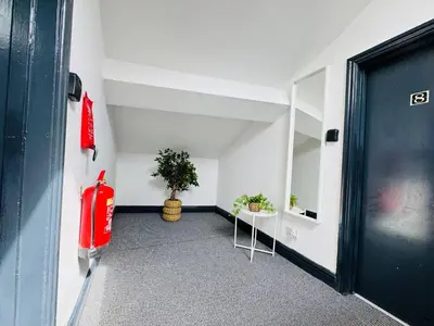 an empty room with a fire hydrant and a door at Pembroke Place Private Room 1 in Liverpool