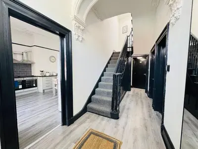a hallway with a staircase in a house at Pembroke Place Private Room 2 in Liverpool