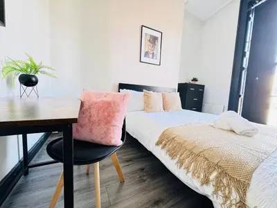 a bedroom with a desk and a bed and a desk at Pembroke Place Private Room 3 in Liverpool