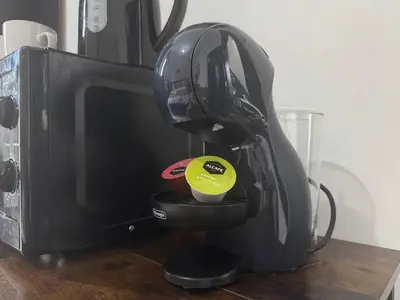 a black mixer sitting next to a microwave at Pembroke Place Private Room 3 in Liverpool