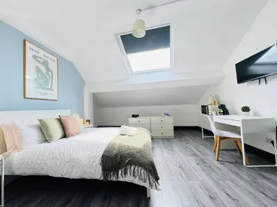 a bedroom with a bed and a desk in it at Pembroke Place Private Room 8 in Liverpool