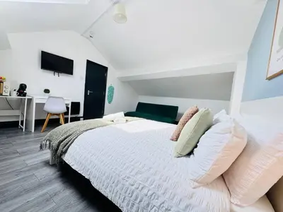 a bedroom with a white bed and a desk at Pembroke Place Private Room 8 in Liverpool