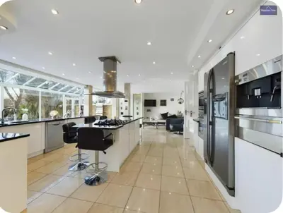 a kitchen with a large island with a counter top at Beautiful House in Blackpool near the beach in Marton