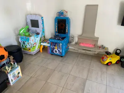 a room filled with toys and a room with a playset at Beautiful House in Blackpool near the beach in Marton