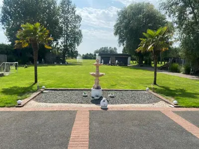 a fountain in the middle of a park with trees at Beautiful House in Blackpool near the beach in Marton