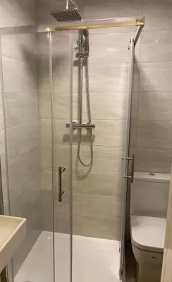 a shower stall in a bathroom with a toilet at 6 bedroom house with Riverviews - Free parking in Preston
