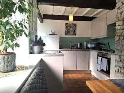 a kitchen with white cabinets and a stove top oven at The Coach House, Yealand Redmayne perfect for a family in a rural setting, bring your dogs and horse in Beetham