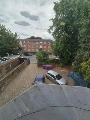 a car parked in a parking lot next to a building at Holly House in Liverpool