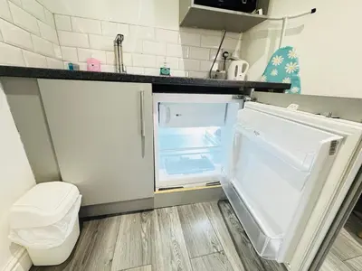 an empty refrigerator with its door open in a kitchen at Bold Street Studio I in Liverpool