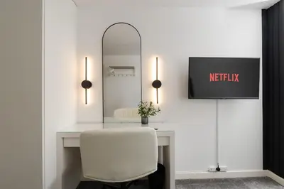 a white desk with a white chair and a mirror at Luxury Liverpool City Centre Apartment with Balcony, Sleeps 8, Near Liverpool ONE and Royal Albert Docks in Liverpool