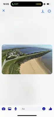 an aerial view of a beach and the ocean at the mountain view in Millom