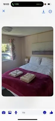 a bedroom with a bed with two towels on it at the mountain view in Millom