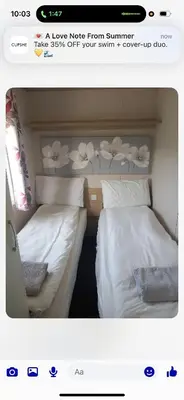 two beds sitting next to each other in a room at the mountain view in Millom