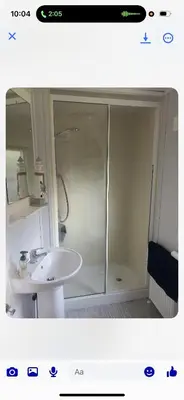 a bathroom with a shower and a sink at the mountain view in Millom