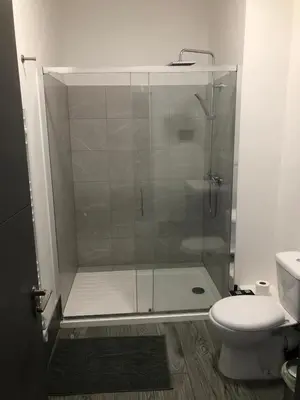 a bathroom with a shower and a toilet at Green-Lodge Triple Double & Single Rooms Near LFC Anfield Free Street Parking 24-7 in Liverpool