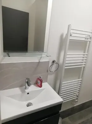 a bathroom with a white sink and a mirror at Green-Lodge Triple Double & Single Rooms Near LFC Anfield Free Street Parking 24-7 in Liverpool