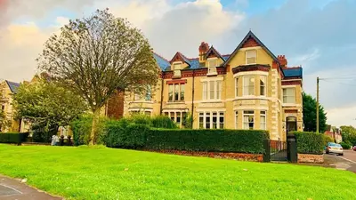 a large house with a green lawn in front of it at Green-Lodge Triple Double & Single Rooms Near LFC Anfield Free Street Parking 24-7 in Liverpool