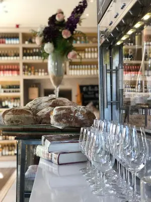 a bunch of wine glasses on a counter with some bread at Beautiful 2 bedroom house in the heart of Lytham in Lytham St Annes