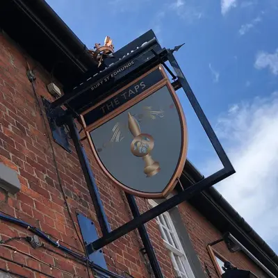 a clock on the side of a brick building at Beautiful 2 bedroom house in the heart of Lytham in Lytham St Annes