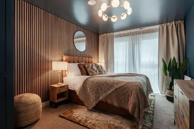 a bedroom with a bed and a chandelier at Boutique Escape The Tabac Rooms By Casaco in Liverpool
