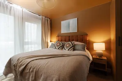 a bedroom with a large bed and a window at Boutique Escape The Tabac Rooms By Casaco in Liverpool